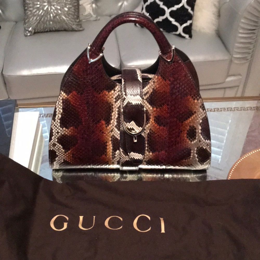 (SOLD) Gucci python top handle stirrup bag
